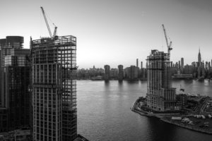 black and white photo of buildings under construction